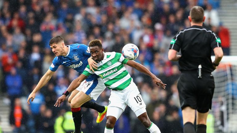 Moussa Dembele and Rob Kiernan in action during the Betfred Cup Semi-Final