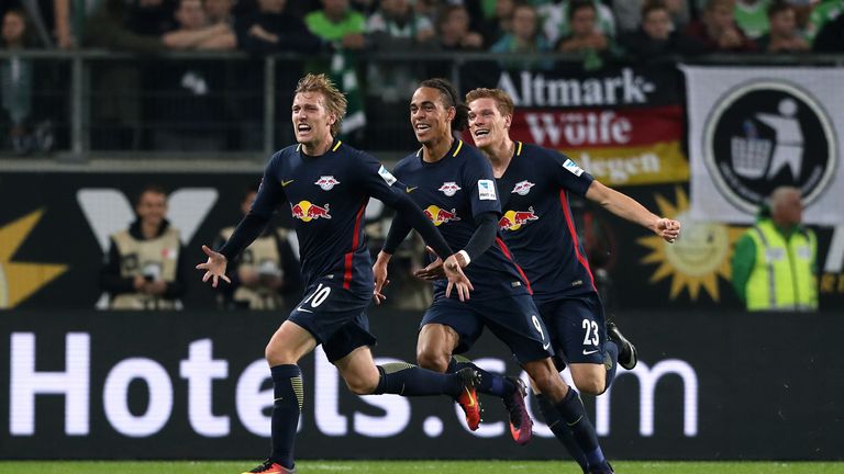 Leipzig's Emil Forsberg celebrates scoring his team's opening goal with Yussuf Poulsen and Marcel Halstenberg