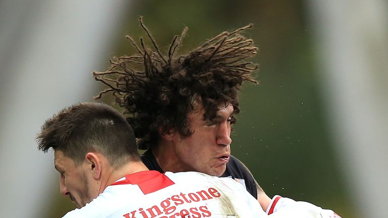 Tohu Harris of New Zealand crashes into Gareth Widdop of England during the Four Nations match at Huddersfield