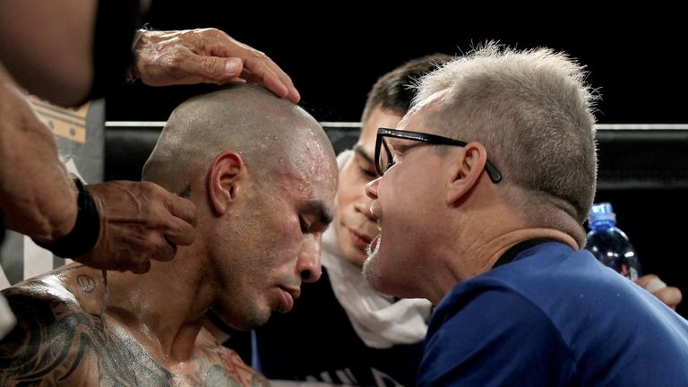 LAS VEGAS, NV - NOVEMBER 21:  Miguel Cotto talks with trainer Freddie Roach as he takes on Canelo Alvarez during their middleweight fight at the Mandalay B