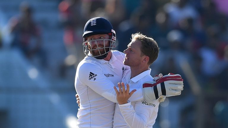 CHITTAGONG, BANGLADESH - OCTOBER 21:  Gareth Batty of England celebrates with Jonathan Bairstow after dismissing Tamin Iqbal of Bangladesh during day two o