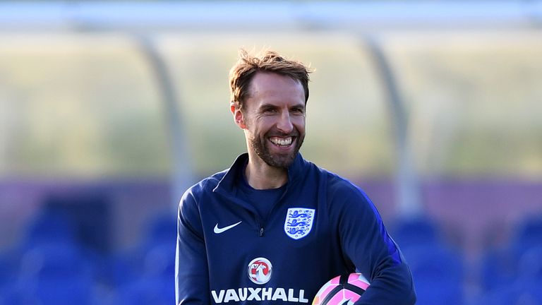 BURTON-UPON-TRENT, ENGLAND - OCTOBER 04:  Interim England manager Gareth Southgate smiles during an England training session at St George's Park on October