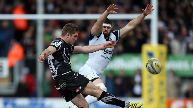 Gareth Steenson of Exeter kicks upfield under pressure from Guy Mercer of Bath during the Aviva Premiership at Sandy Park on February 28, 2016
