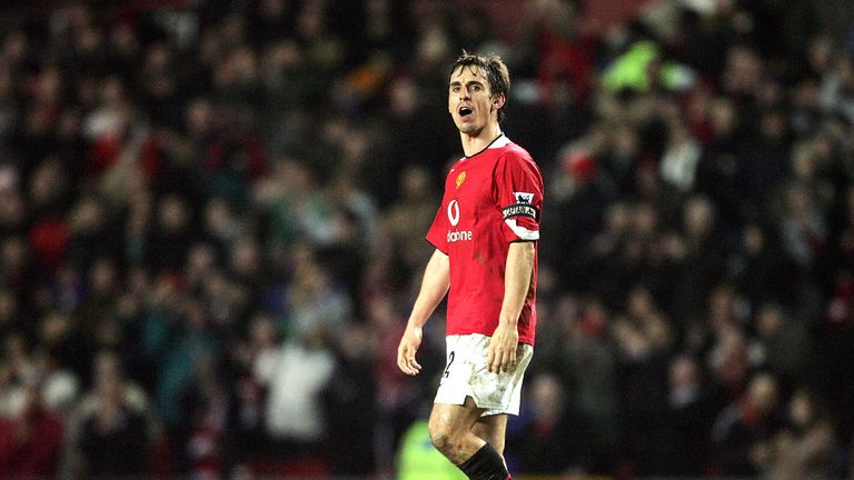 Gary Neville looks to the Liverpool fans after Manchester United win at Old Trafford in January 2006