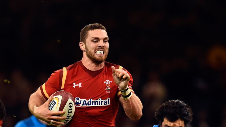 CARDIFF, WALES - MARCH 19:  George North of Wales races away from Luke McLean to score during the RBS Six Nations match between Wales and Italy at the Prin