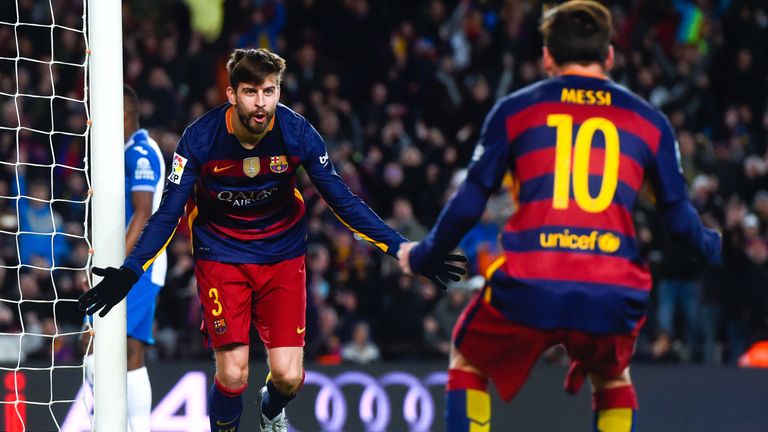 BARCELONA, SPAIN - JANUARY 06:  Gerard Pique of FC Barcelona celebrates with his teammate Lionel Messi of FC Barcelona after scoring his team's third goal 