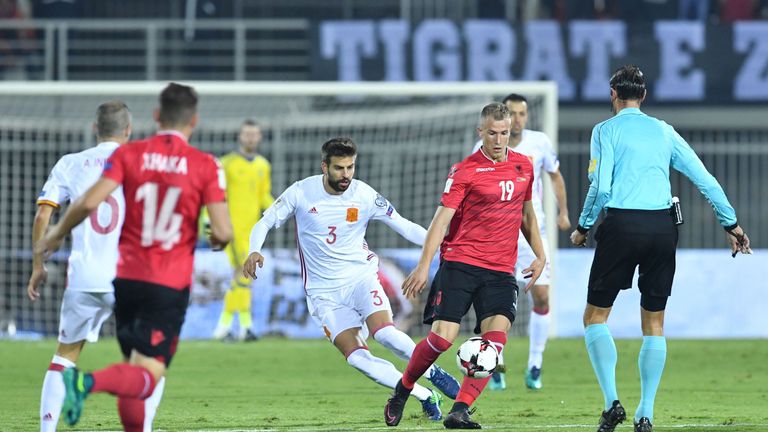 Albania's Bekim Balaj (2R) vies with Spain's Gerard Pique (C) during the FIFA World Cup 2018 qualification football match Albania vs Spain at the Loro-Bori