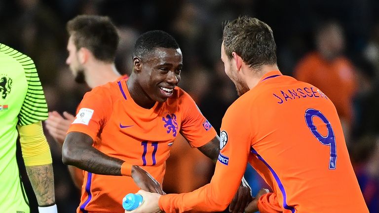 Netherlands' Quincy Promes (C) and Netherlands' Vincent Janssen (R) celebrate after their team's victory during the FIFA World Cup 2018 qualification footb