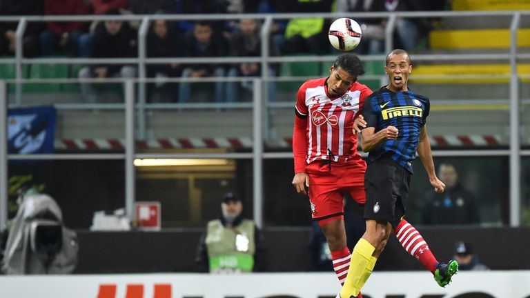 Inter Milan's Brazilian defender Joao Miranda (R) heads the ball with Southampton's Dutch defender Virgil Van Dijk during the Europa League group K footbal