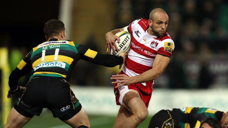 Gloucester's Charlie Sharples is tackled by Northampton Saints George North