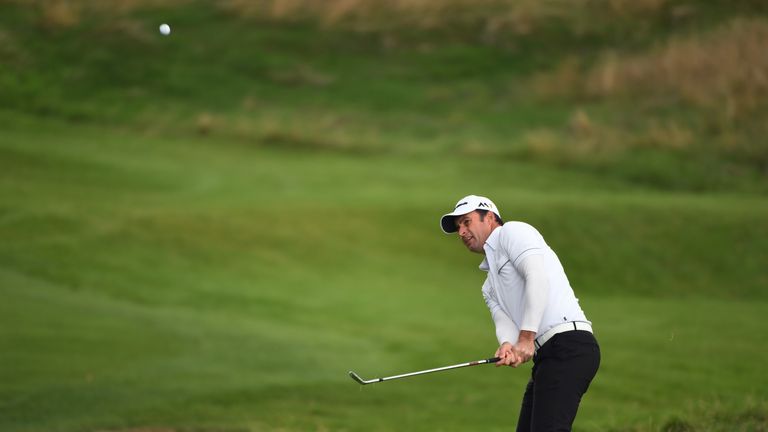 WATFORD, ENGLAND - OCTOBER 15:  Richard Bland of England plays his third shot on the second hole  during the third round of the British Masters at The Grov