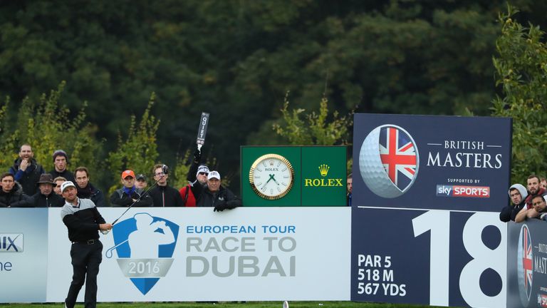 WATFORD, ENGLAND - OCTOBER 13:  Graeme McDowell of Northern Ireland hits his tee shot on the 18th hole during the first round of the British Masters at The