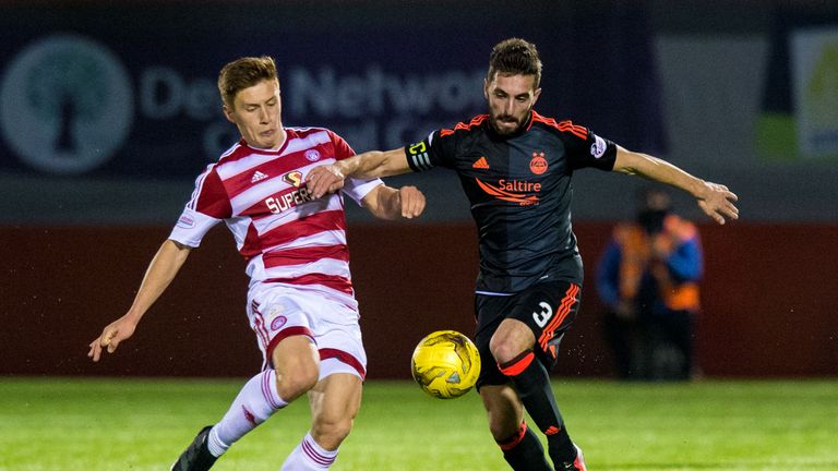 Hamilton's Greg Doherty (left) battles for the ball with Aberdeen's Graeme Shinnie