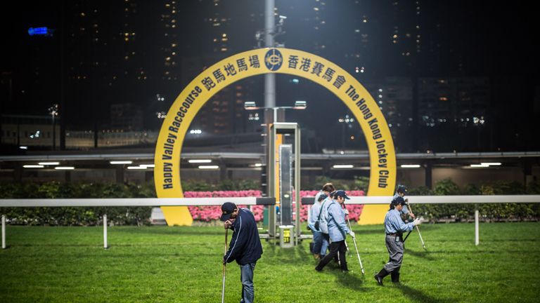 In this picture taken on March 31, 2016, workers repair the turf at Happy Valley.