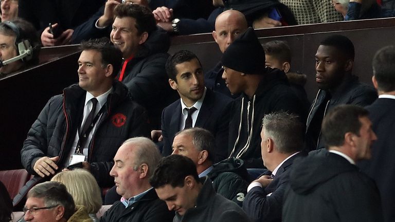 Henrikh Mkhitaryan is pictured with Anthony Martial in the stands at Old Trafford