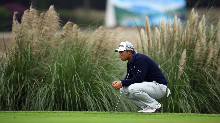 Hideki Matsuyama of Japan considers a shot at the 18th hole during the second round of the World Golf Championships-HSBC Champions golf tournament in Shang