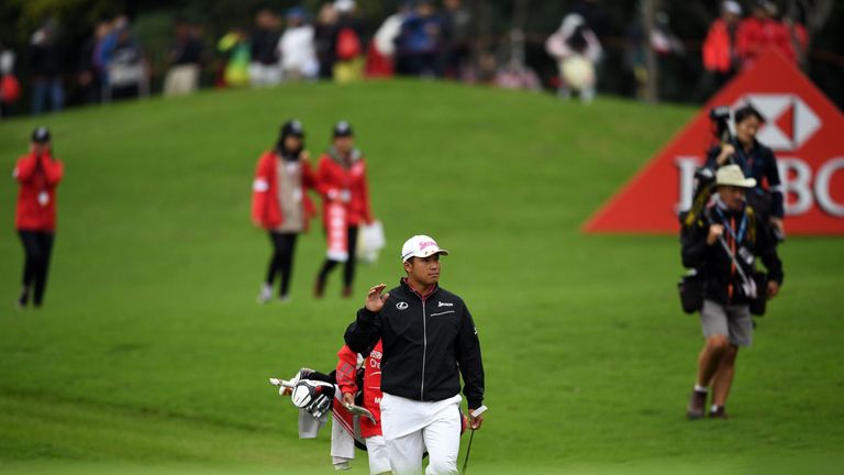 Hideki Matsuyama of Japan (C) is pictured on the 18th during the third round of the World Golf Championships-HSBC Champions golf tournament in Shanghai on 
