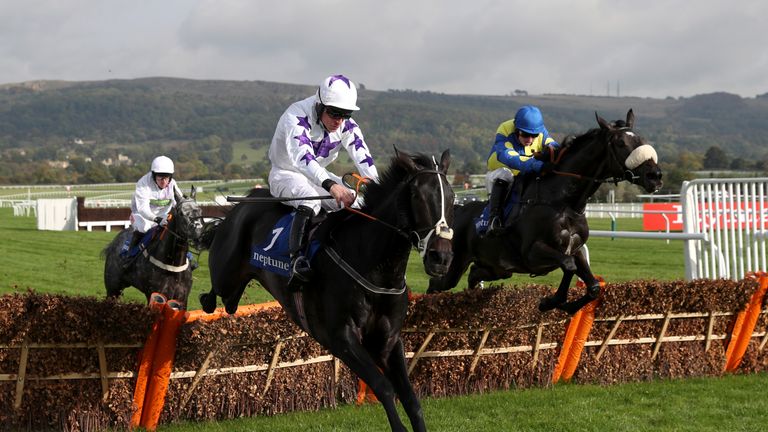 El Bandit ridden by Sean Bowen (right) on his way to victory in the Neptune Investment Management Novices' Hurdle ahead of Black Warrior (nearest).