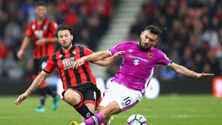 Harry Arter of AFC Bournemouth (L) is fouled by Robert Snodgrass of Hull City (R) 
