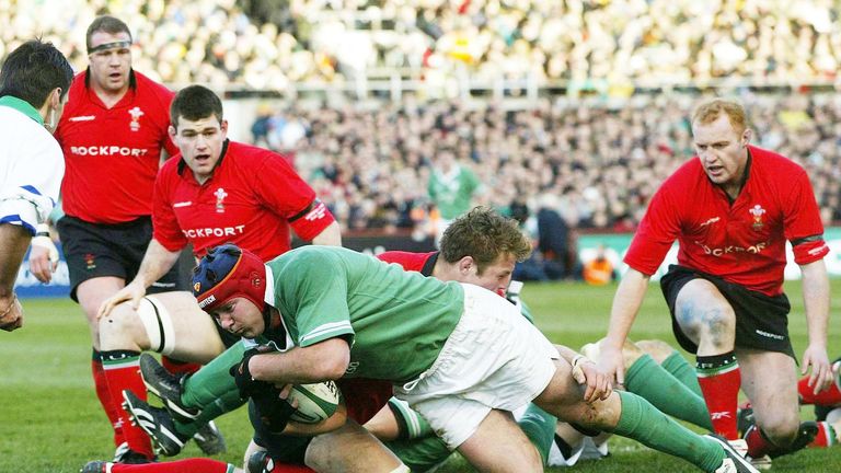 Ireland's Anthony Foley dives over the line to score a try for Ireland against Wales