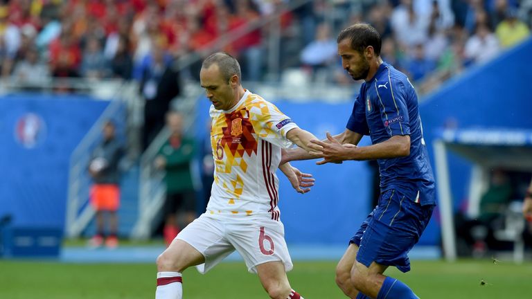 Andreas Iniesta of Spain and Giorgio Chiellini of Italy compete for the ball during the UEFA EURO 2016 round of 16 match 