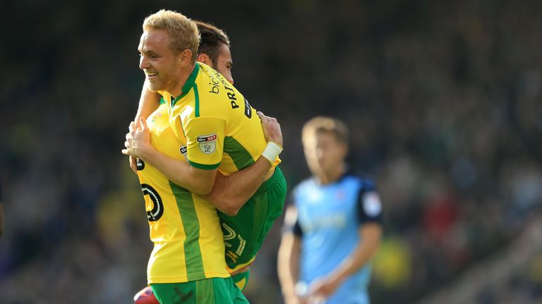 Ivo Pinto and Alex Pritchard of Norwich celebrate Wes Hoolahan's goal