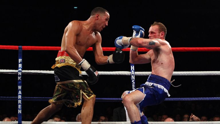 James DeGale (L) of England pushes George Groves of England back in the British and Commonwealth Super-Middleweight Championship