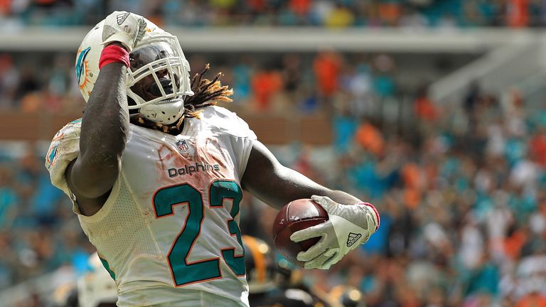 MIAMI GARDENS, FL - OCTOBER 16:  Jay Ajayi #23 of the Miami Dolphins celebrates a touchdown during a game against the Pittsburgh Steelers on October 16, 20