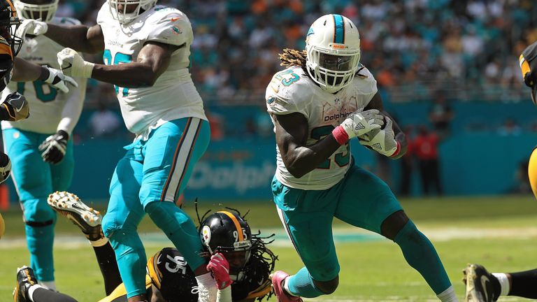 MIAMI GARDENS, FL - OCTOBER 16:  Jay Ajayi #23 of the Miami Dolphins rushes during a game against the Pittsburgh Steelers on October 16, 2016 in Miami Gard