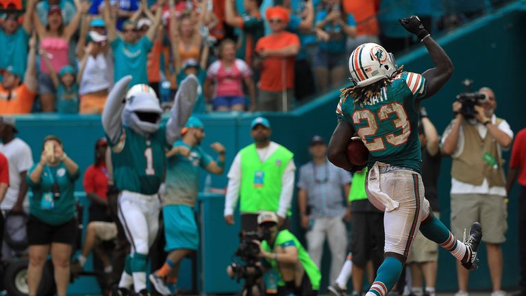 MIAMI GARDENS, FL - OCTOBER 23:  Jay Ajayi #23 of the Miami Dolphins celebrates a touchdown during a game against the Buffalo Bills at Hard Rock Stadium on