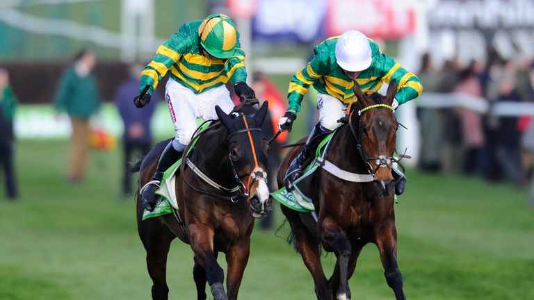 CHELTENHAM, ENGLAND - MARCH 11: Barry Geraghty riding Jezki (L) win The Stan James Champion Hurdle from My Tent Or Yours and Tony McCoy (R) at Cheltenham r