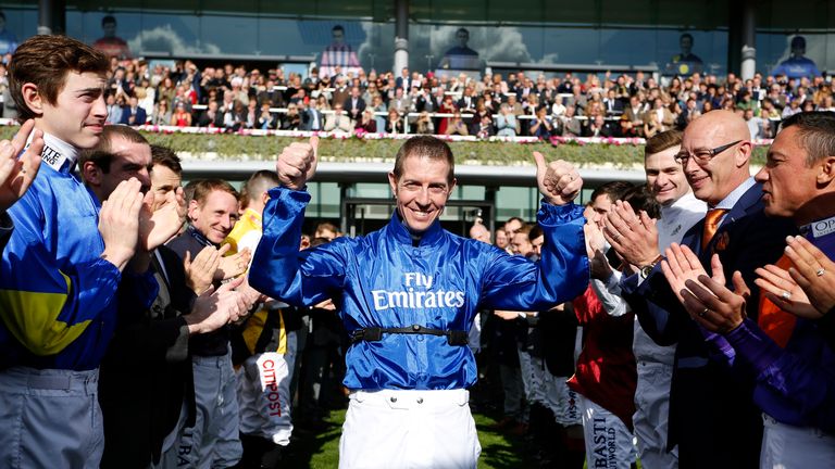 ASCOT, ENGLAND - OCTOBER 15: A guard of honour for Stobart Champion Flat Jockey Jim Crowley at Ascot Racecourse on October 15, 2016 in Ascot, England. (Pho