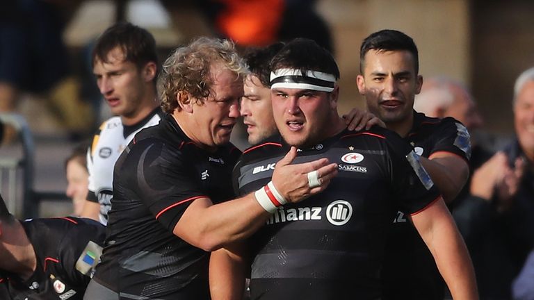 Jamie George of Saracens is congratulated by Petrus du Plessis after scoring their third try 