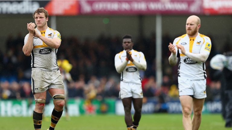 Joe Launchbury (L), Christian Wade (C) and Joe Simpson of Wasps applaud their supporters after a 23-34 defeat to Exeter in the Premiership semi-final