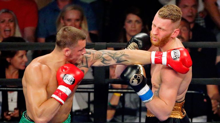 CHICAGO, IL - JUNE 18:  Joe Smith Jr. (red gloves) knocks out Andrzej Fonfara (blue gloves) with a left during the WBC International Light Heavyweight Titl