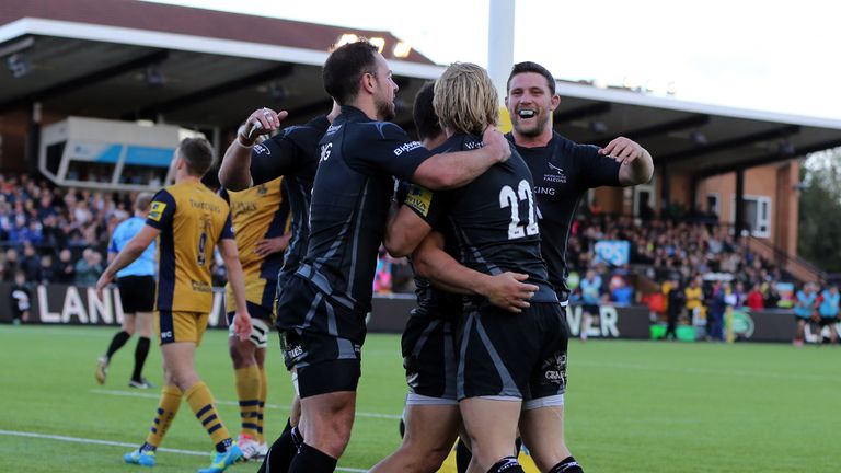 Newcastle players celebrate Joel Hodgson's try against Bristol