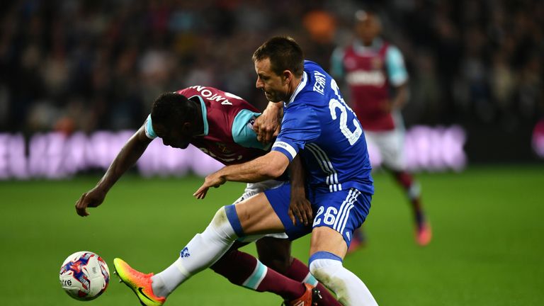  Michail Antonio of West Ham United (L) and John Terry of Chelsea (R) battle for possession 