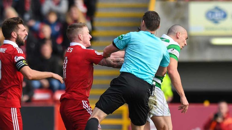 Referee Steve Mclean gets busy as Jonny Hayes (2nd left) and Scott Brown have a difference of opinion