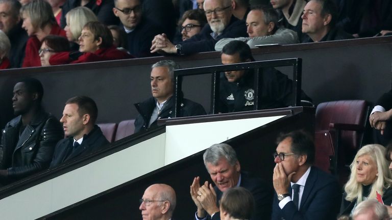 Manchester United manager Jose Mourinho (centre top) watches from the crowd having been sent to the stands by referee Mark Clattenburg