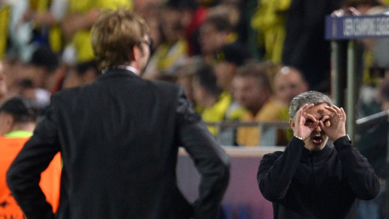 Dortmund's head coach Jurgen Klopp (L) looks on as Real Madrid's Portuguese coach Jose Mourinho (R) gestures 