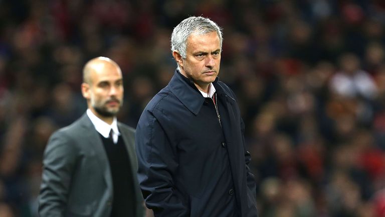 Jose Mourinho  and Pep Guardiola watch from the touchline during the EFL Cup 4th Round