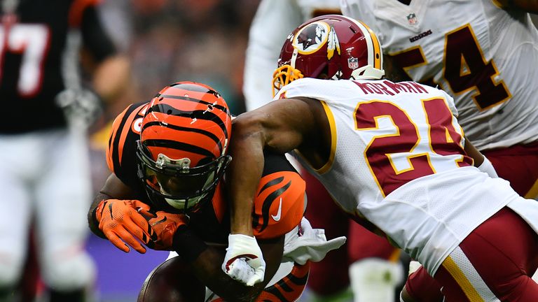 LONDON, ENGLAND - OCTOBER 30:  Giovani Bernard #25 of the Cincinnati Bengals fumbles the ball as he is tackled by Josh Norman #24 of the Washington Redskin