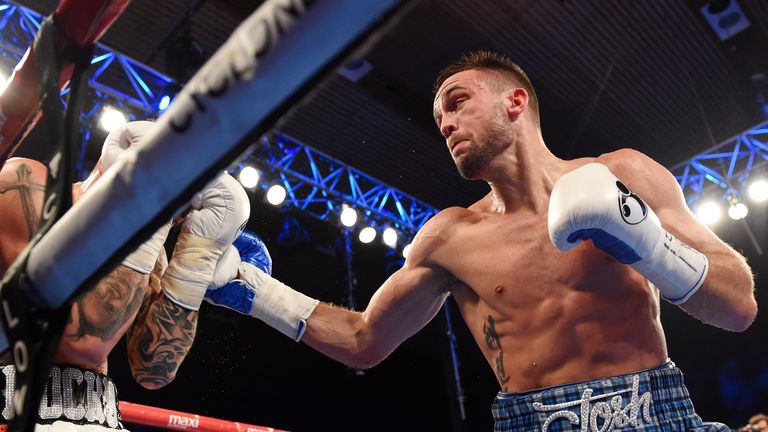 Josh Taylor (right) forces Dave Ryan against the ropes