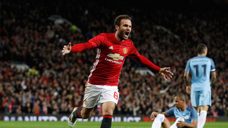 Manchester United's Juan Mata celebrates after scoring his side's first goal 