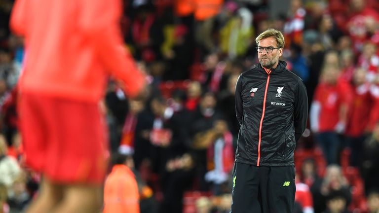 Jurgen Klopp watches his players warm up ahead of the match at Anfield