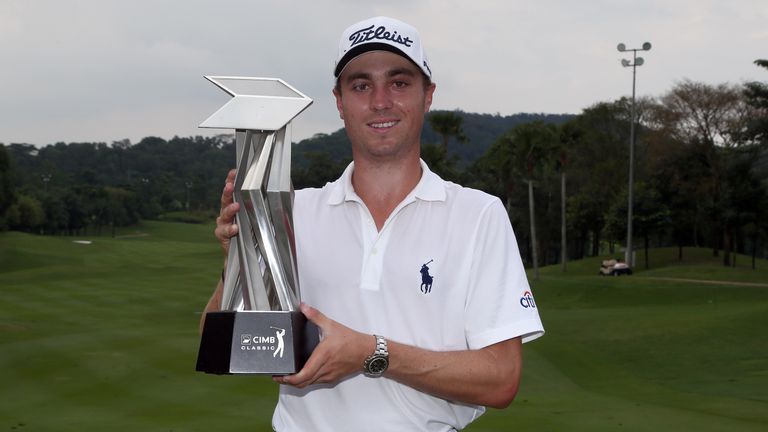 KUALA LUMPUR, MALAYSIA - NOVEMBER 01:  Justin Thomas of the United States poses with the CIMB Classic Trophy after he won it by 26 under 262 during round f