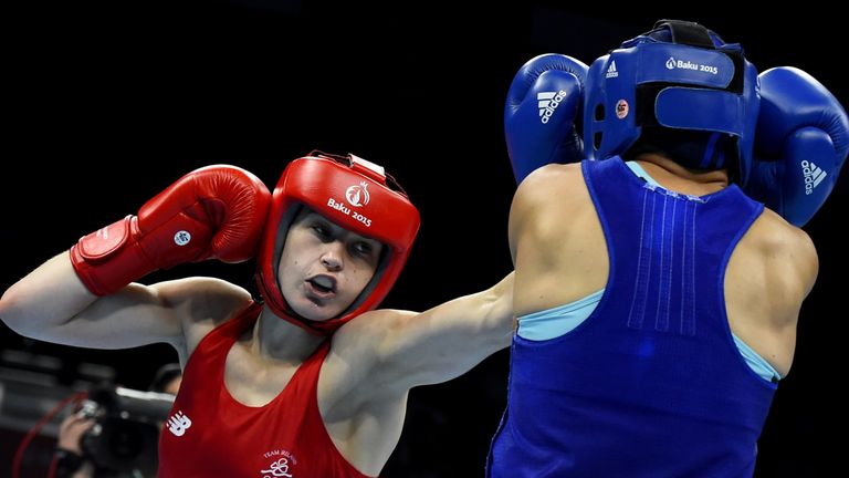Katie Taylor of Ireland (L) punches Denitsa Eliseeva of Bulgaria during their women's light (57-60kg) boxing fight at the 2015 European Games in Baku on Ju