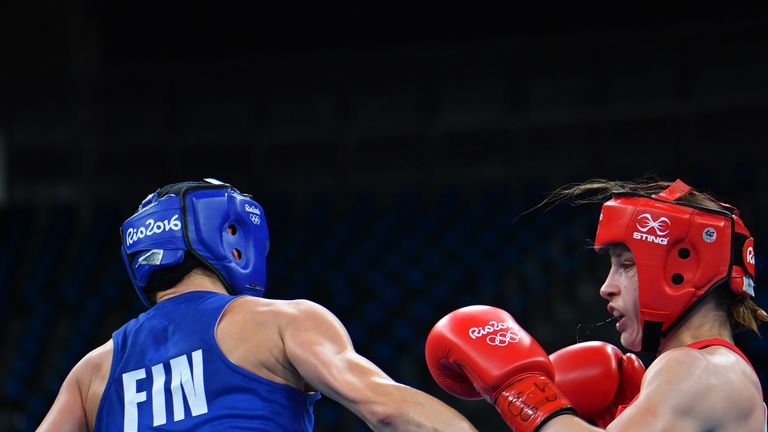 Ireland's Katie Taylor (R) fights Finland's Mira Potkonen during the Women's Light (57-60kg) Quarterfinal 1 match at the Rio 2016 Olympic Games at the Rioc