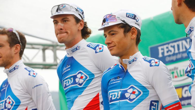 French rider Kenny Elissonde (R), team FDJ, stands on stage before the start of the 110th edition of the giro di Lombardia (Tour of Lombardy), a 241 km cyc