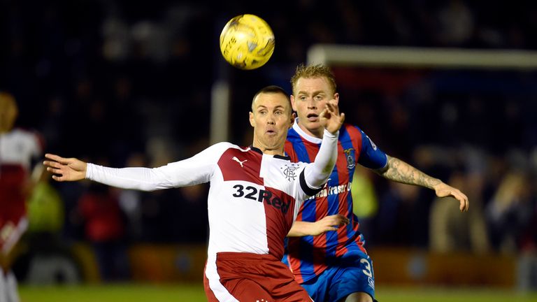 Rangers' Kenny Miller battles for the ball against Inverness CT's Carl Tremarco (right)